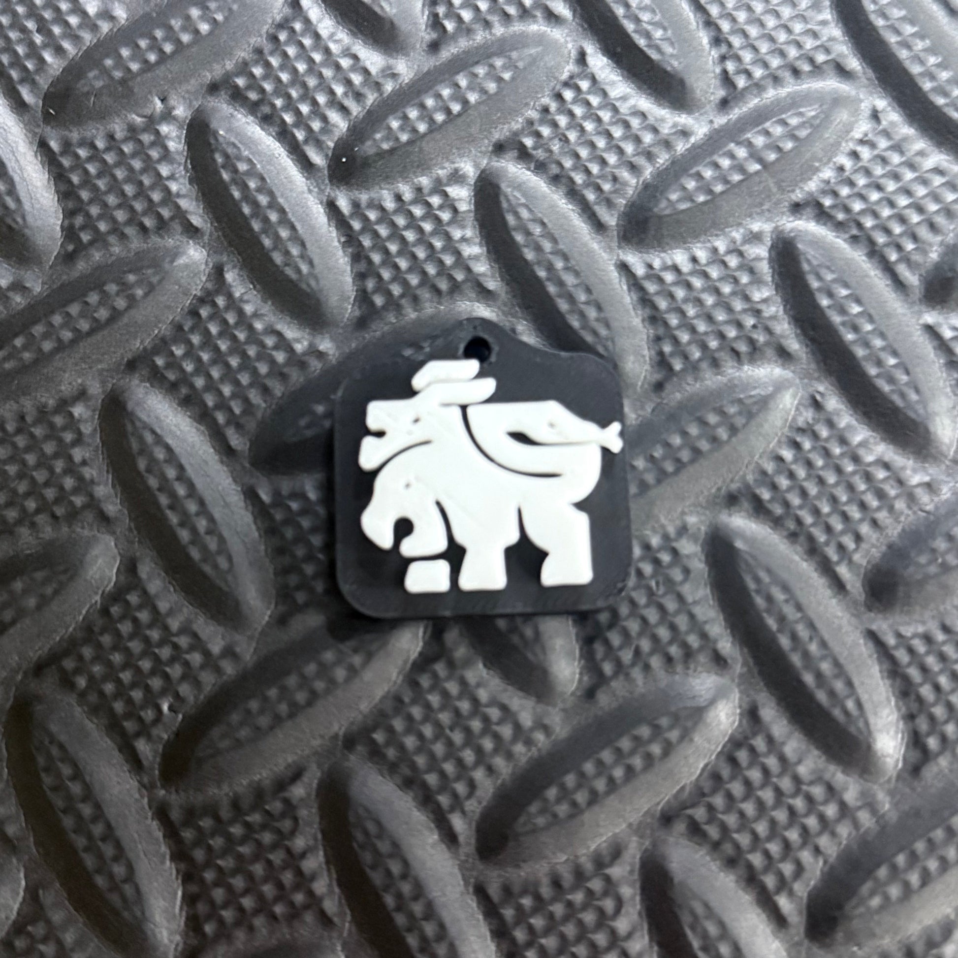 Chimera Studio keychain charm featuring a detailed mythical creature design on a metal keyring.