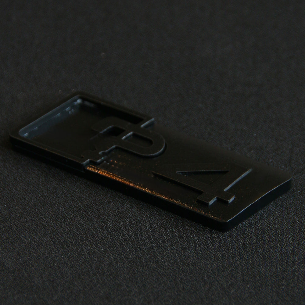 Close-up of a 4 series Badge Upgrade by CHIMERA STUDIO, showcasing detailed craftsmanship and sleek design.