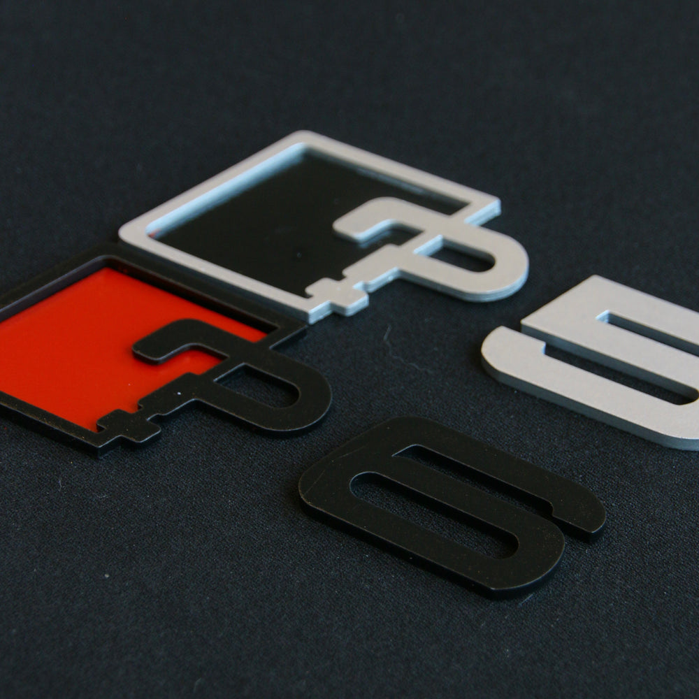 Chimera Studio trunk badge upgrade featuring a sleek, modern badge design displayed on a vehicle trunk surface.
