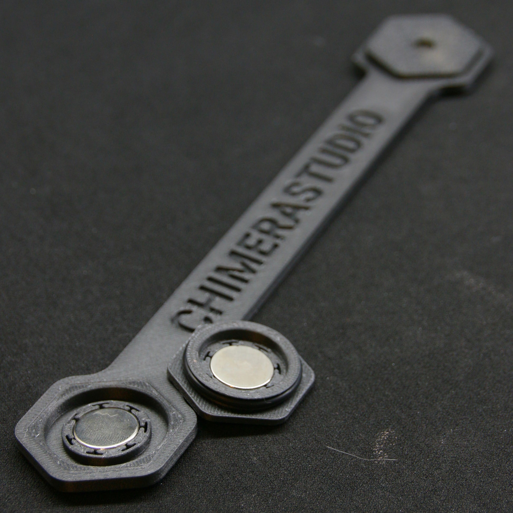 CHIMERA STUDIO V2 Magnetic License Plate Bracket mounted on a vehicle, showcasing a race-ready, secure magnetic attachment system