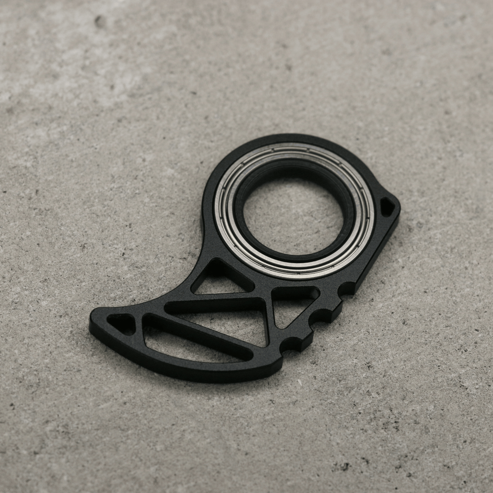 Keyrmbt Pro 3.0 keychain spinner with sleek design, compact size, and metallic finish, perfect for fidgeting or stress relief.