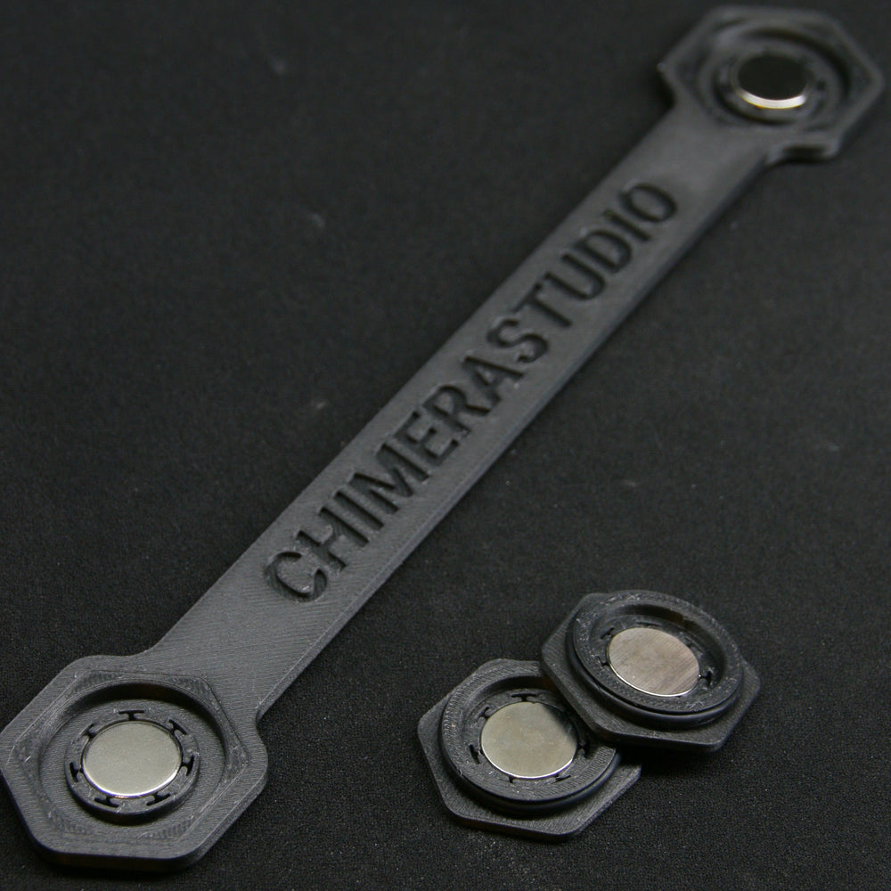 Magnetic V2 License Plate Bracket by CHIMERA STUDIO mounted on a car, showing easy attachment and sleek design for vehicle customization.